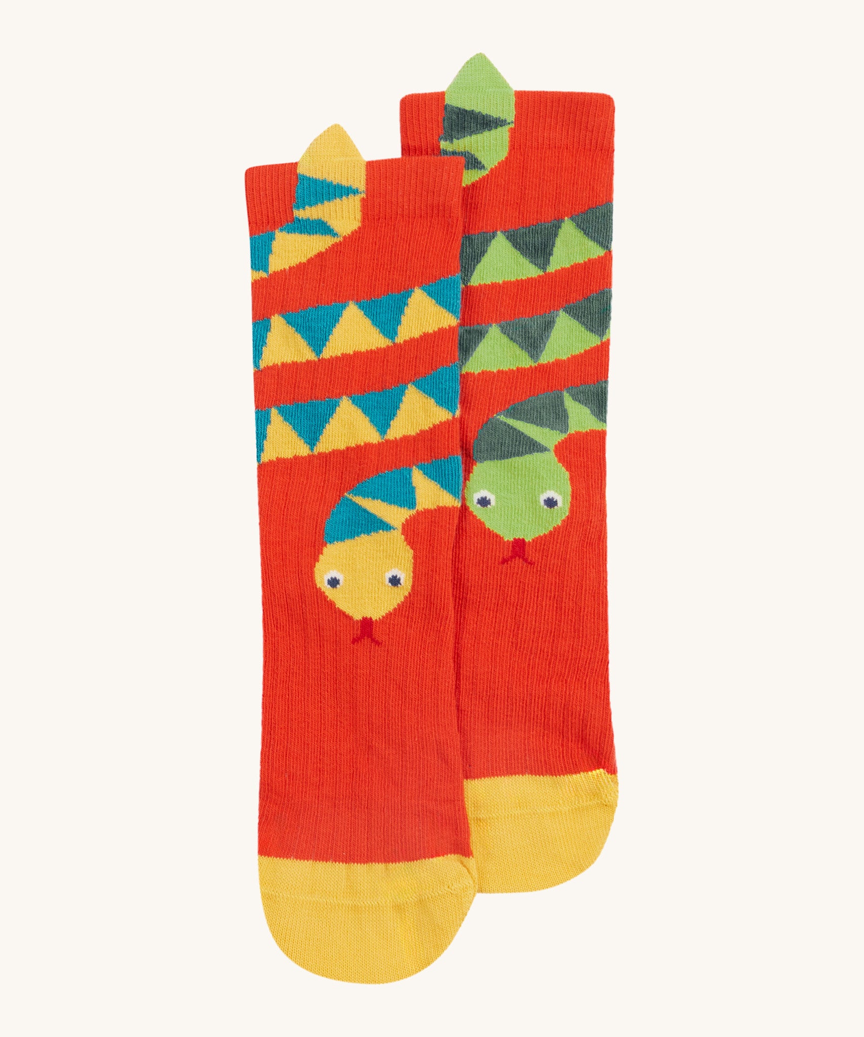 Frugi kids character socks showing a yellow snake with blue patterns and a green snake with yellow toe panels on orange organic cotton fabric