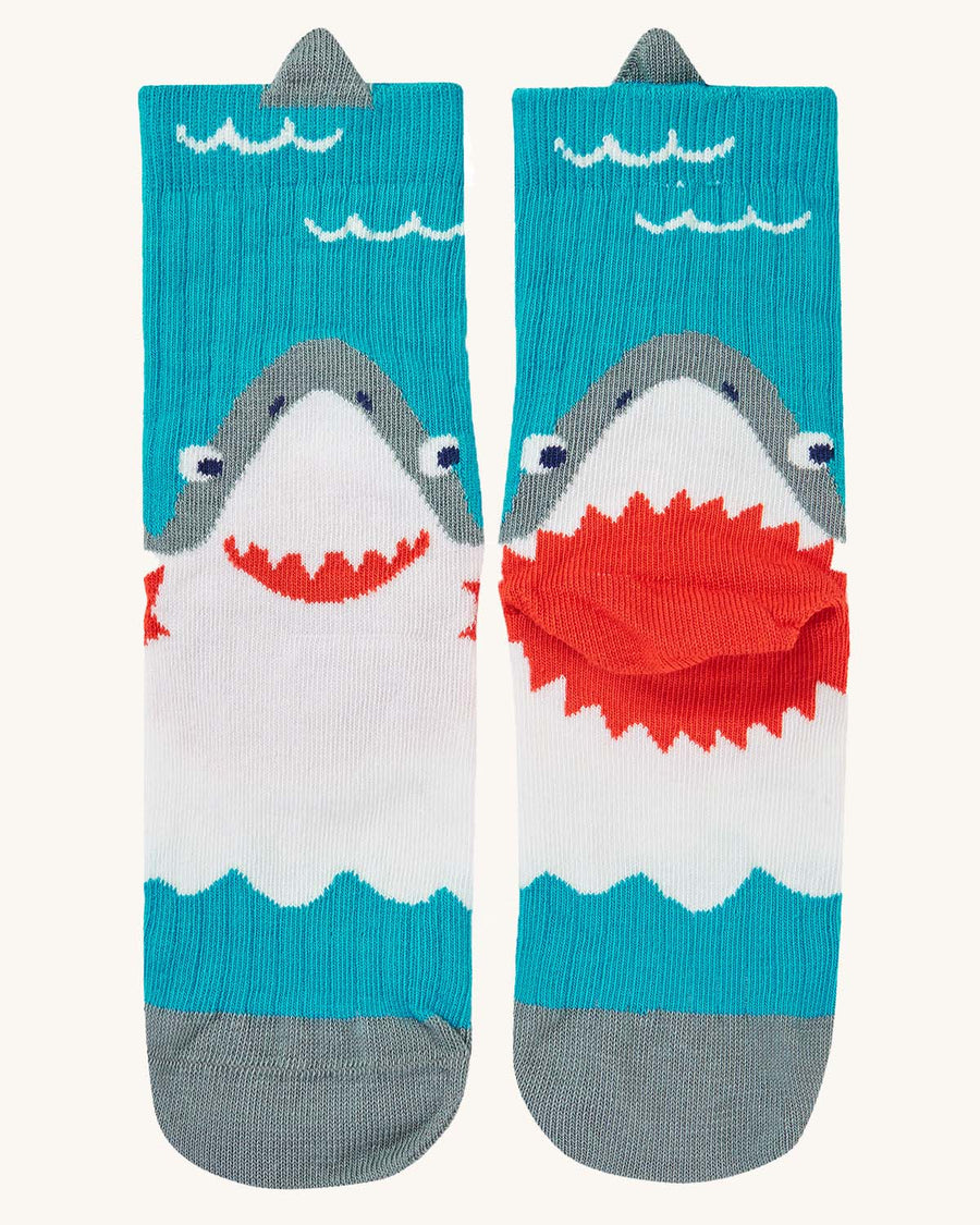  the right paid of socks are of a shark in