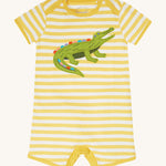 Frugi kids crocodile rue romper - GOTS organic cotton romper with yellow and white stripes, short sleeve and legs. Features an appliqué of a green crocodile on the front and popper fasteners on the inside of the legs for easy fitting.