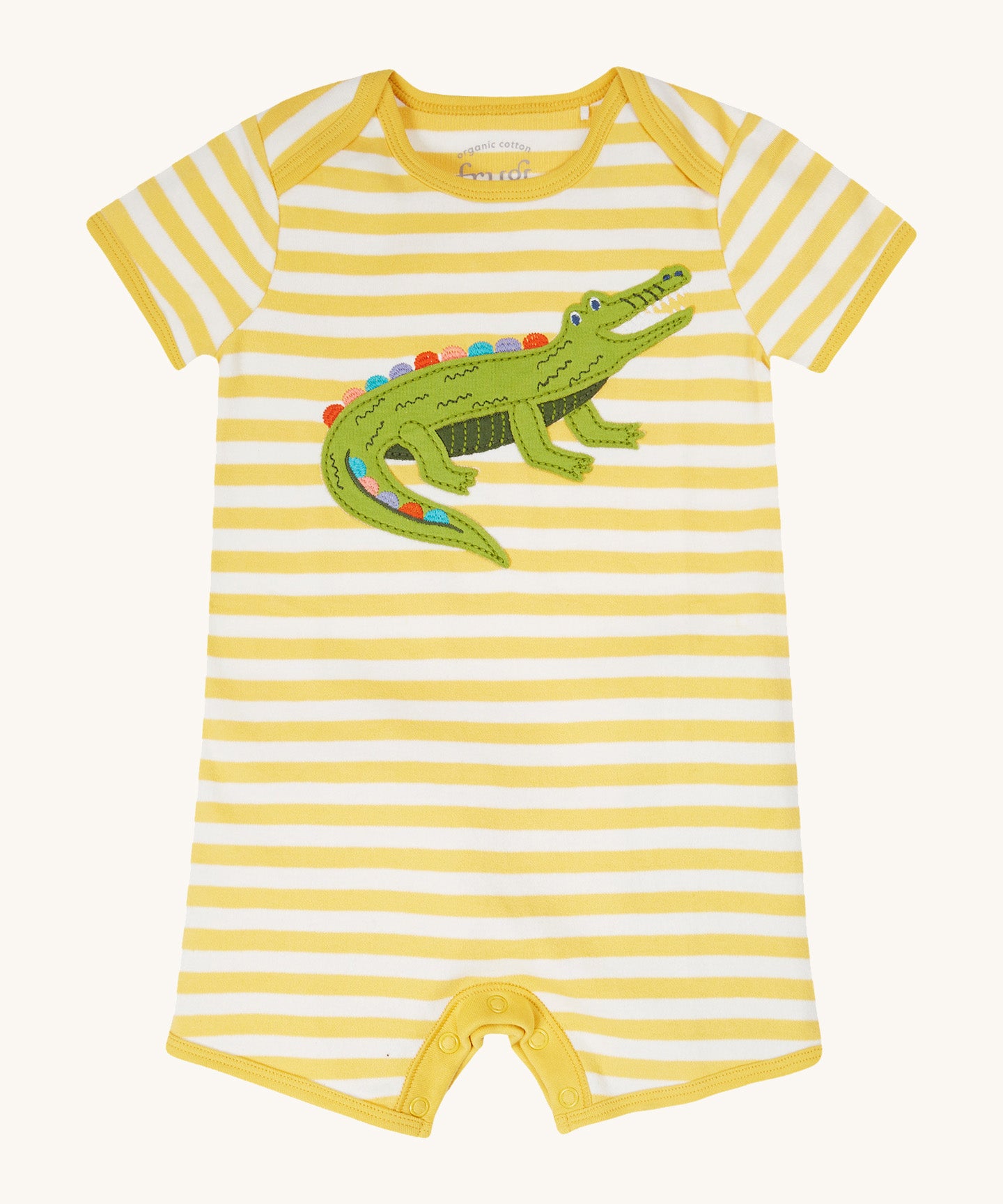 Frugi kids crocodile rue romper - GOTS organic cotton romper with yellow and white stripes, short sleeve and legs. Features an appliqué of a green crocodile on the front and popper fasteners on the inside of the legs for easy fitting.