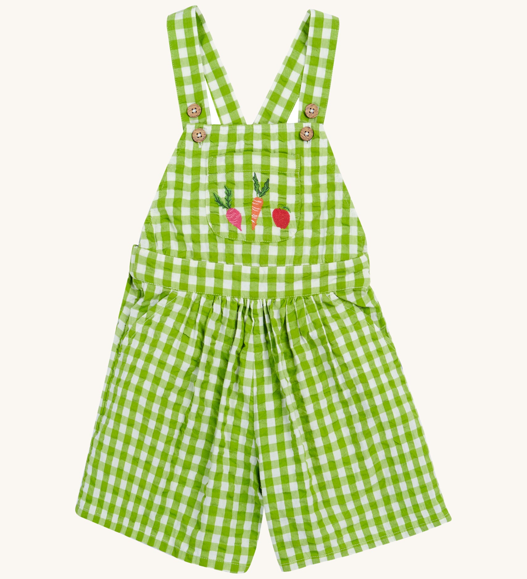 Frugi kids macaw gingham, veg Cassie culotte dungarees - GOTS organic cotton kids dungarees with green and white gingham, button fasteners on the shoulder straps for easy fitting with a front pouch pocket. Features an embroidery of  a beetroot, carrot and apple.