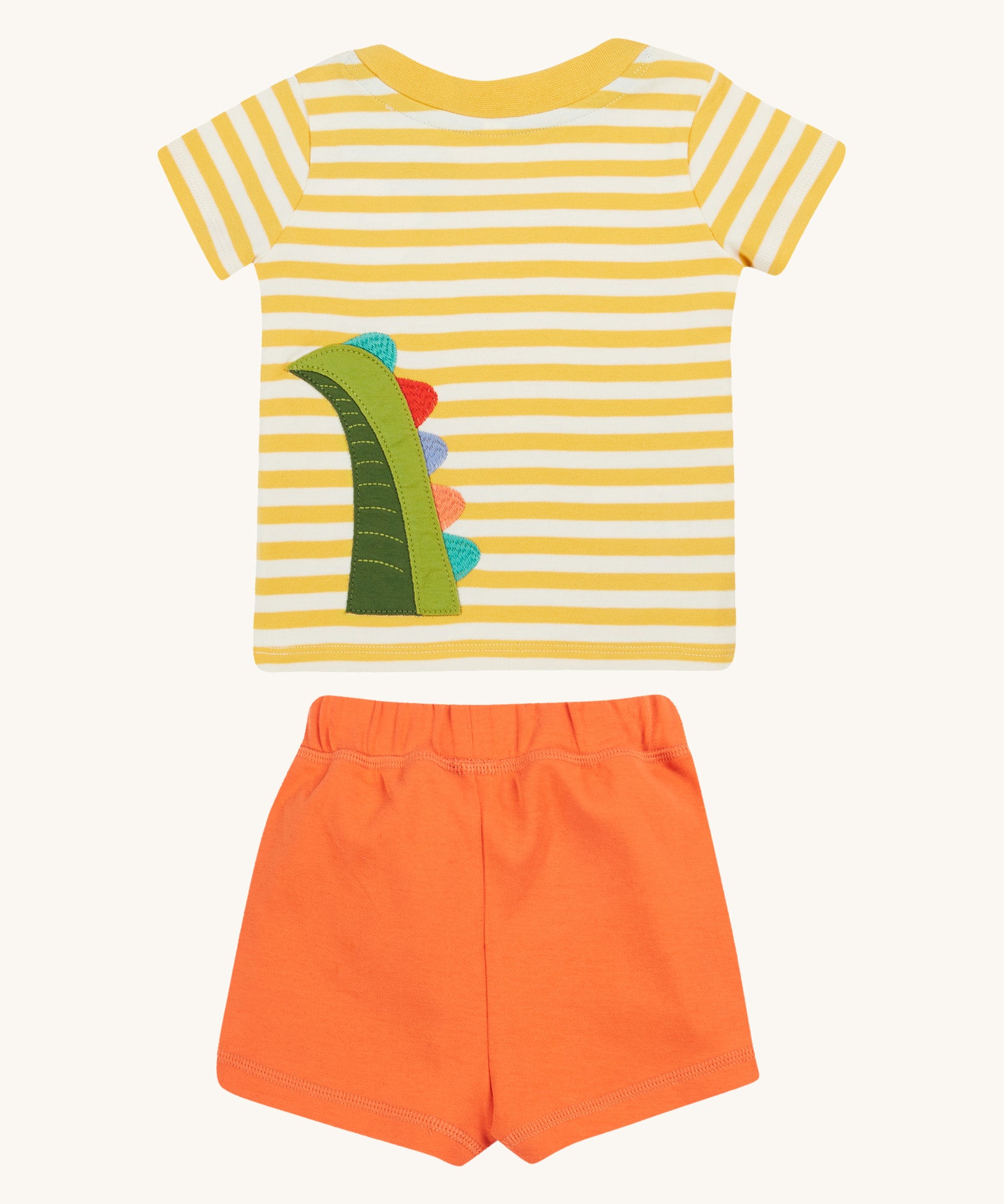 Frugi kids easy wrap around crocodile outfit. GOTS organic cotton Frugi kids outfit with a yellow and white stripe, short sleeve t-shirt, yellow neck trim and orange short. Features a crocodile's tail applique on the back of the t-shirt.