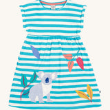 Frugi kids Felicity koala dress with a white and light blue stripes, sleeveless and features a appliqué of a kola next to different coloured appliqué leaves