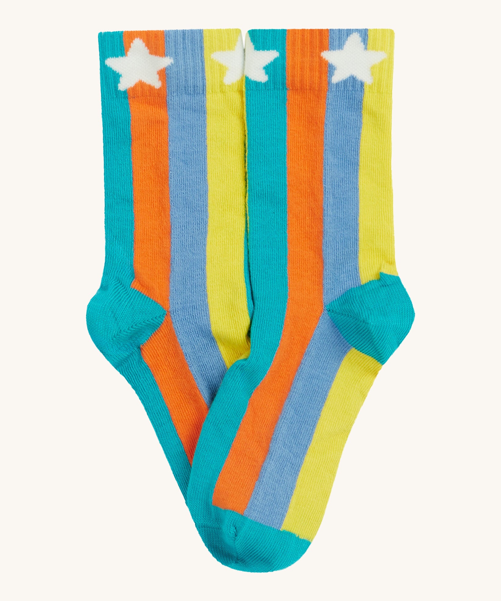 Close up of the Frugi multicoloured stripe sunnie socks. Showing the white stars the striped ankle cuff. Features a blue heel and toe contrast panel on striped organic cotton fabric