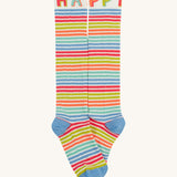 Frugi kids hygge knee high sock with happy slogan on the leg cuff with a light blue toe and heel panel on multicoloured striped organic cotton fabric