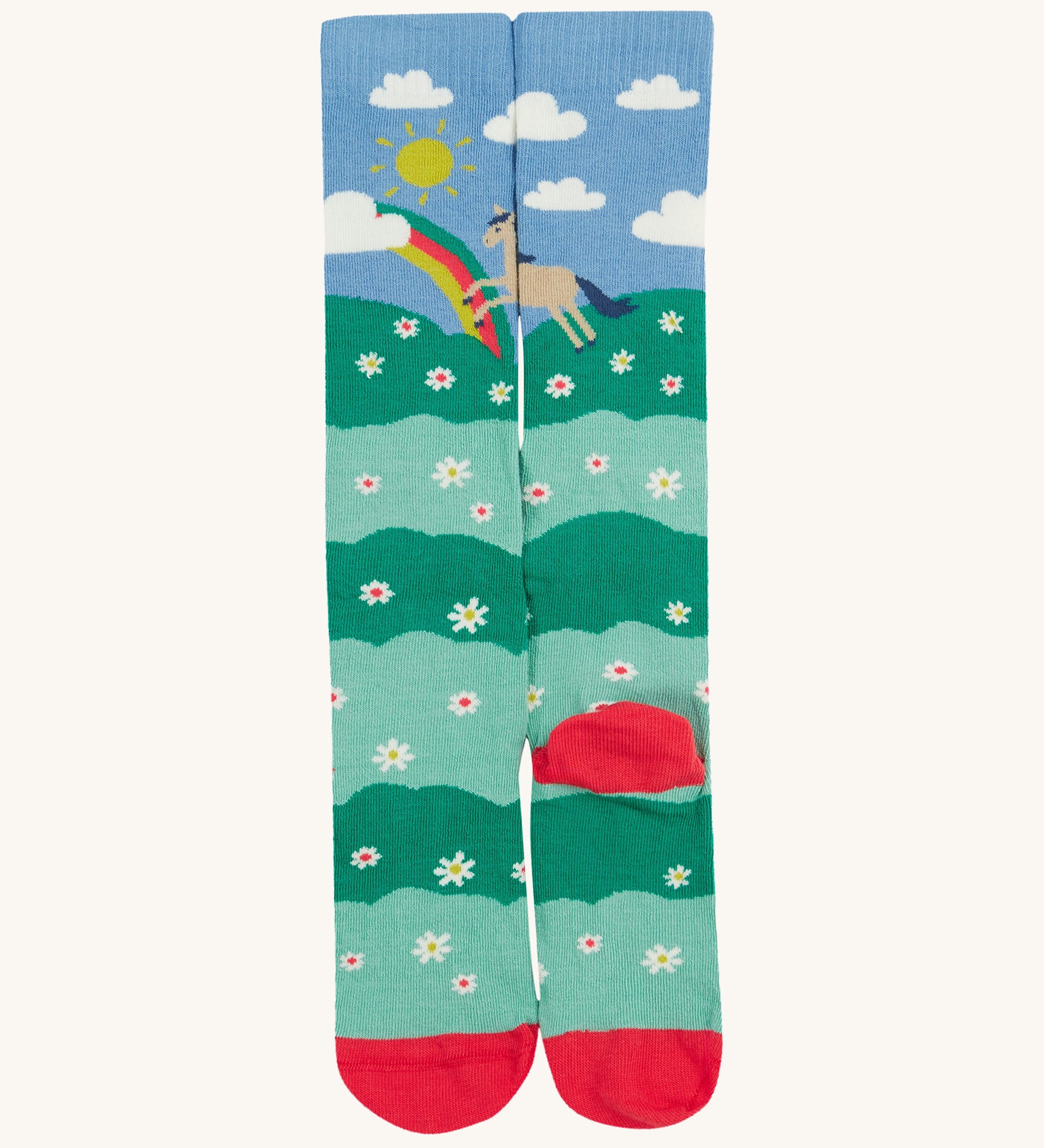 Frugi kids hygge knee high sock showing horse in a field of daisies design with toe and heel panel sock on organic cotton fabric