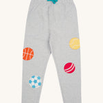 Frugi kids jack appliqué joggers - GOTS kids joggers in grey with a turquoise waist drawstring. Features an appliqué of a basket ball, football, cricket ball and tennis ball