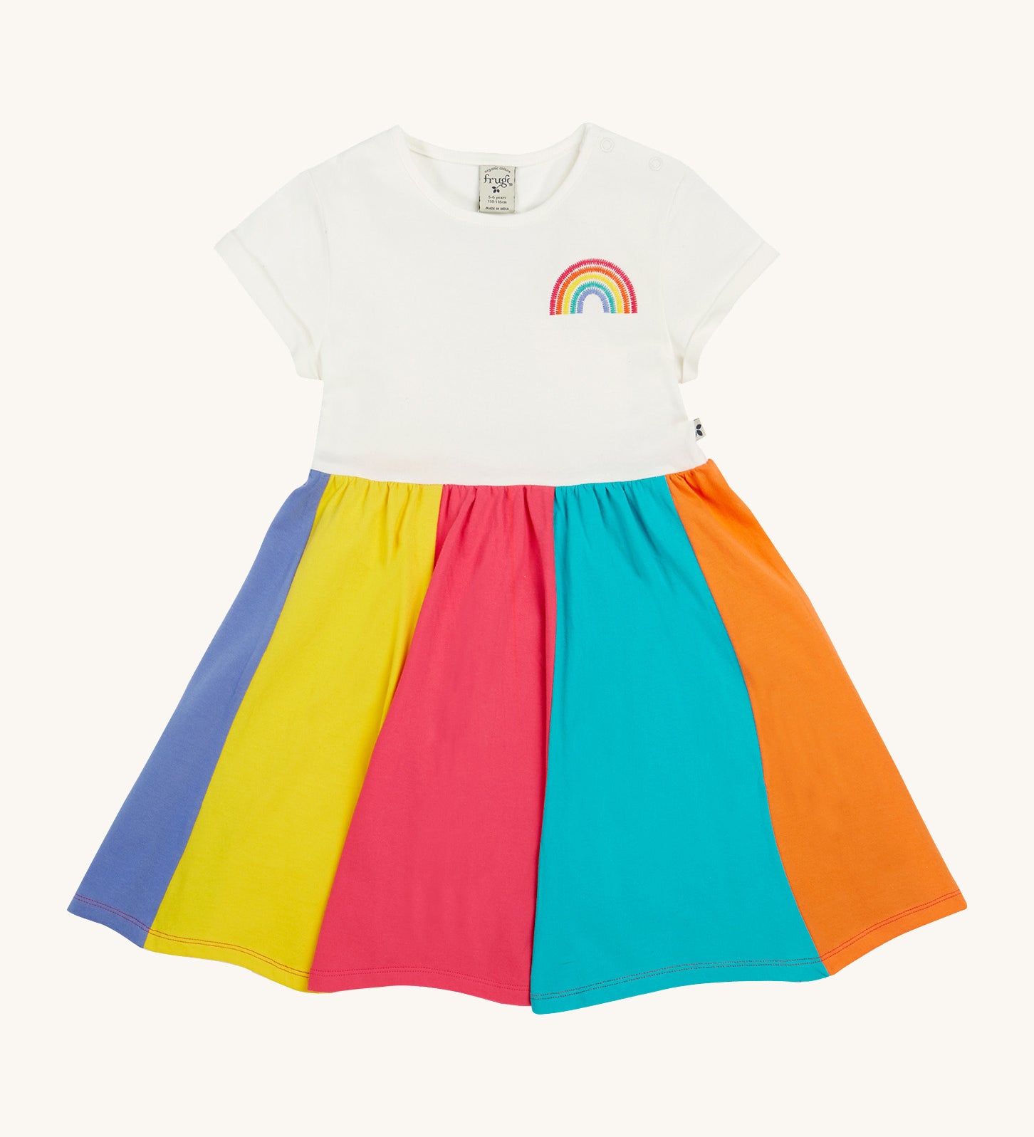 Frugi kids jersey rainbow dress - GOTS organic cotton kids dress with a white top half and a rainbow block colour bottom half. Features a rainbow embroidery on the top half of the dress.