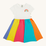 Frugi kids jersey rainbow dress - GOTS organic cotton kids dress with a white top half and a rainbow block colour bottom half. Features a rainbow embroidery on the top half of the dress.