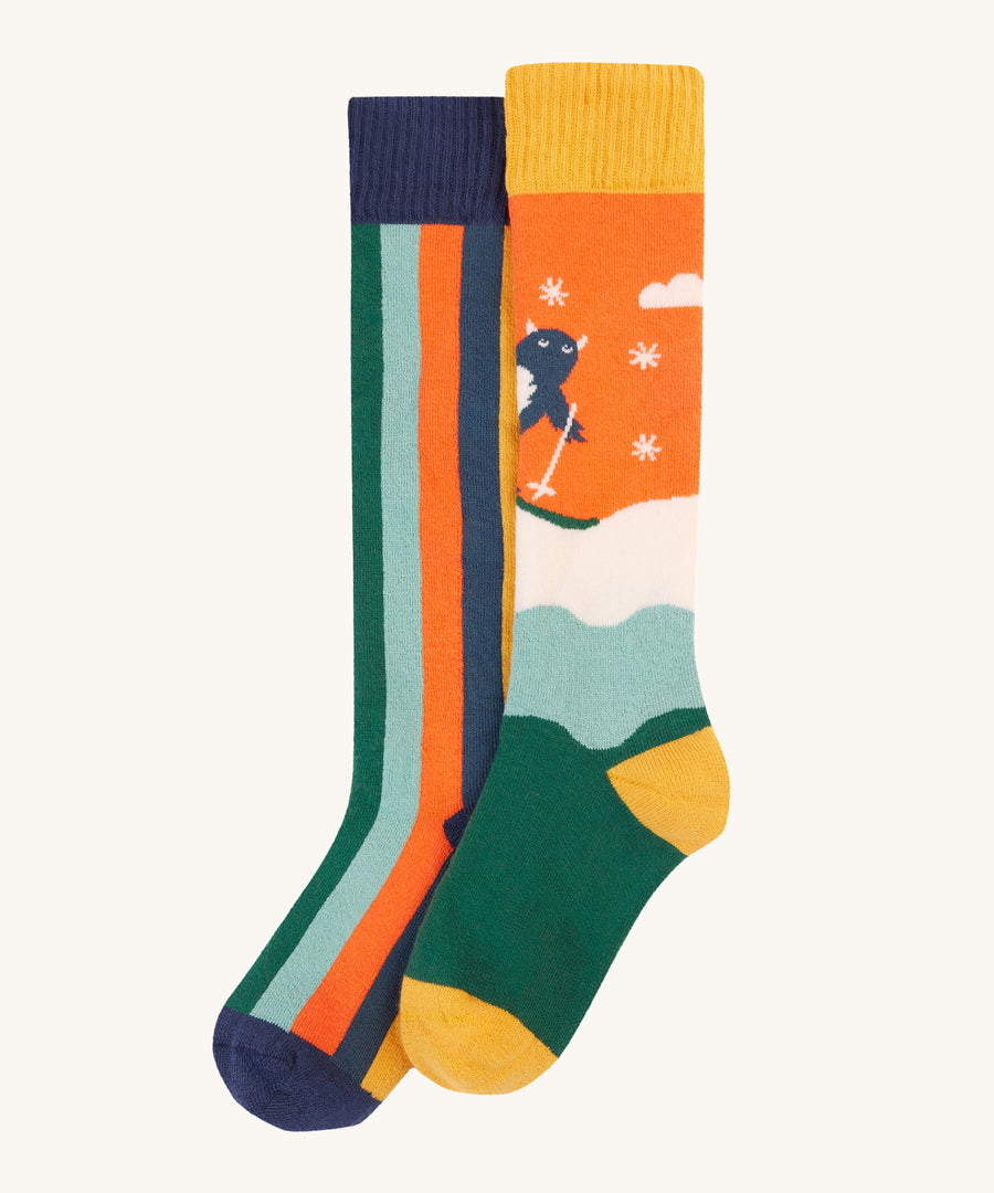 Frugi Children's Brilliant Boot Socks 2 Pack - Yeti. One pair has bold navy stripes while the other has a playful skiing Yeti design.