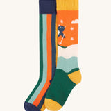 Frugi Children's Brilliant Boot Socks 2 Pack - Yeti. One pair has bold navy stripes while the other has a playful skiing Yeti design.