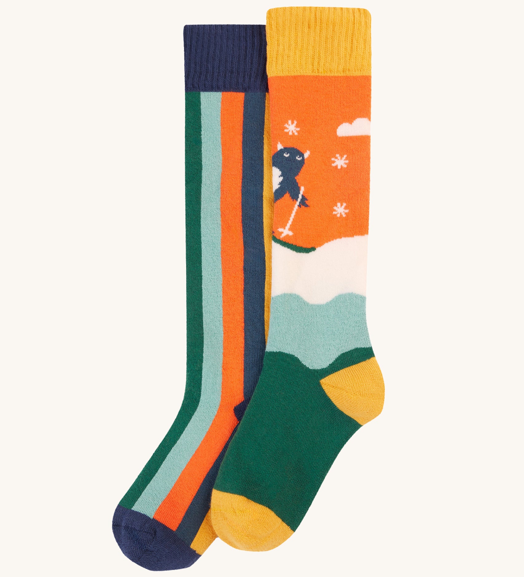 Frugi Children's Brilliant Boot Socks 2 Pack - Yeti. One pair has bold navy stripes while the other has a playful skiing Yeti design.