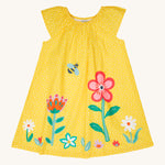 Frugi kids lowen flower dress - GOTS organic cotton kids dress in yellow with white spots and sleeveless. Features a yellow bee print flying over different flowers.