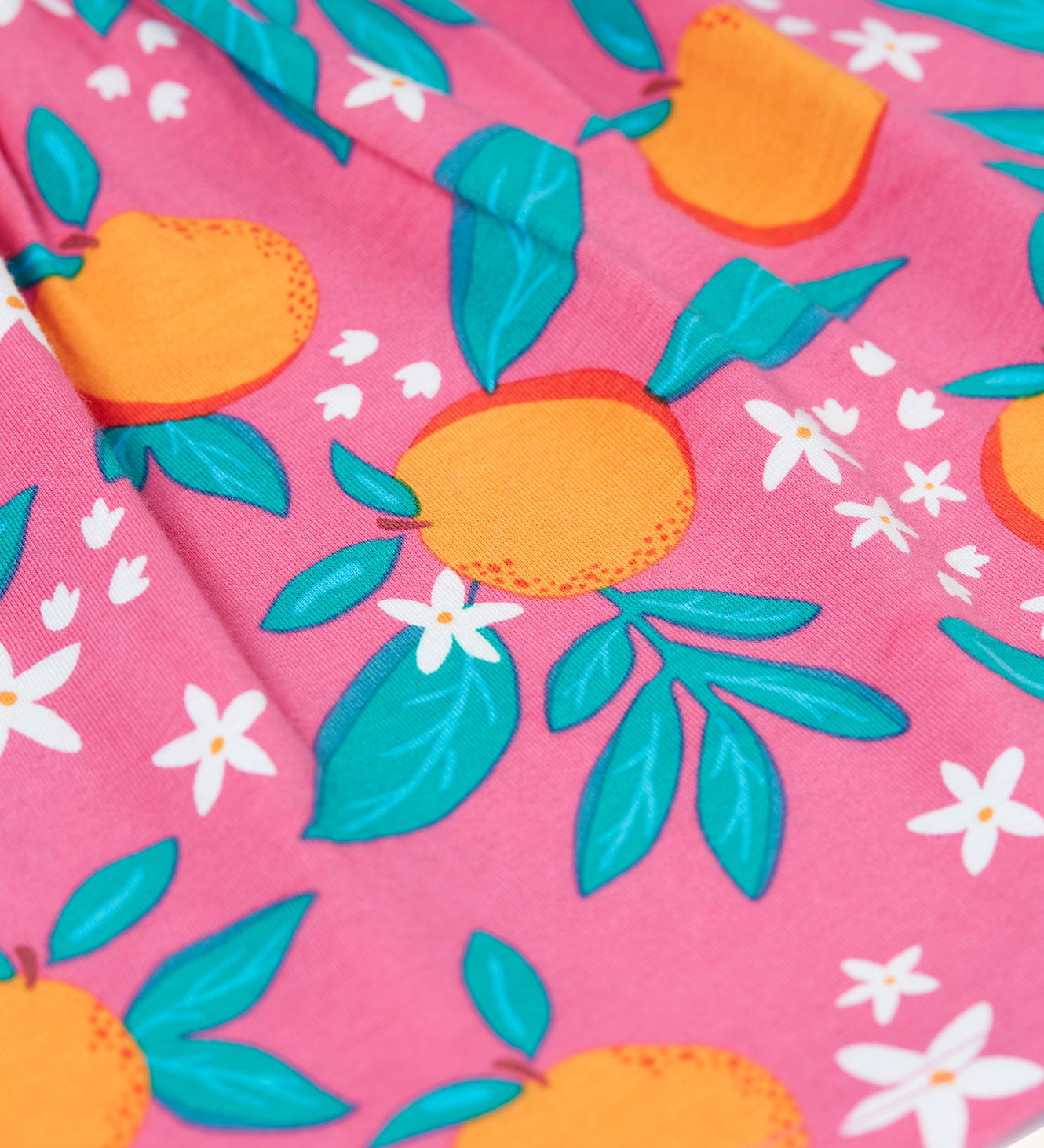  organic pink tunic-style cotton top with an all over orange blossom print