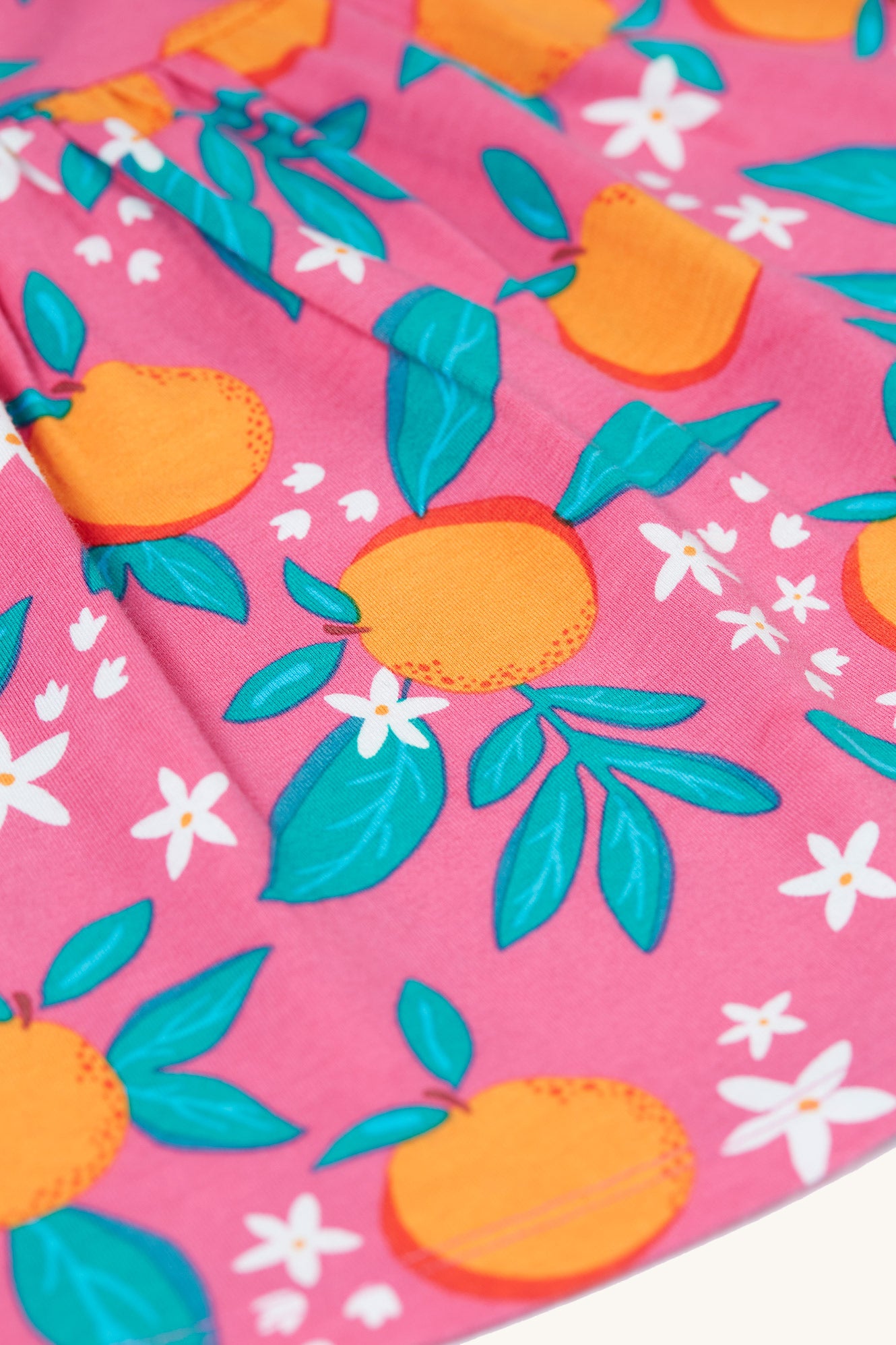  organic pink tunic-style cotton top with an all over orange blossom print