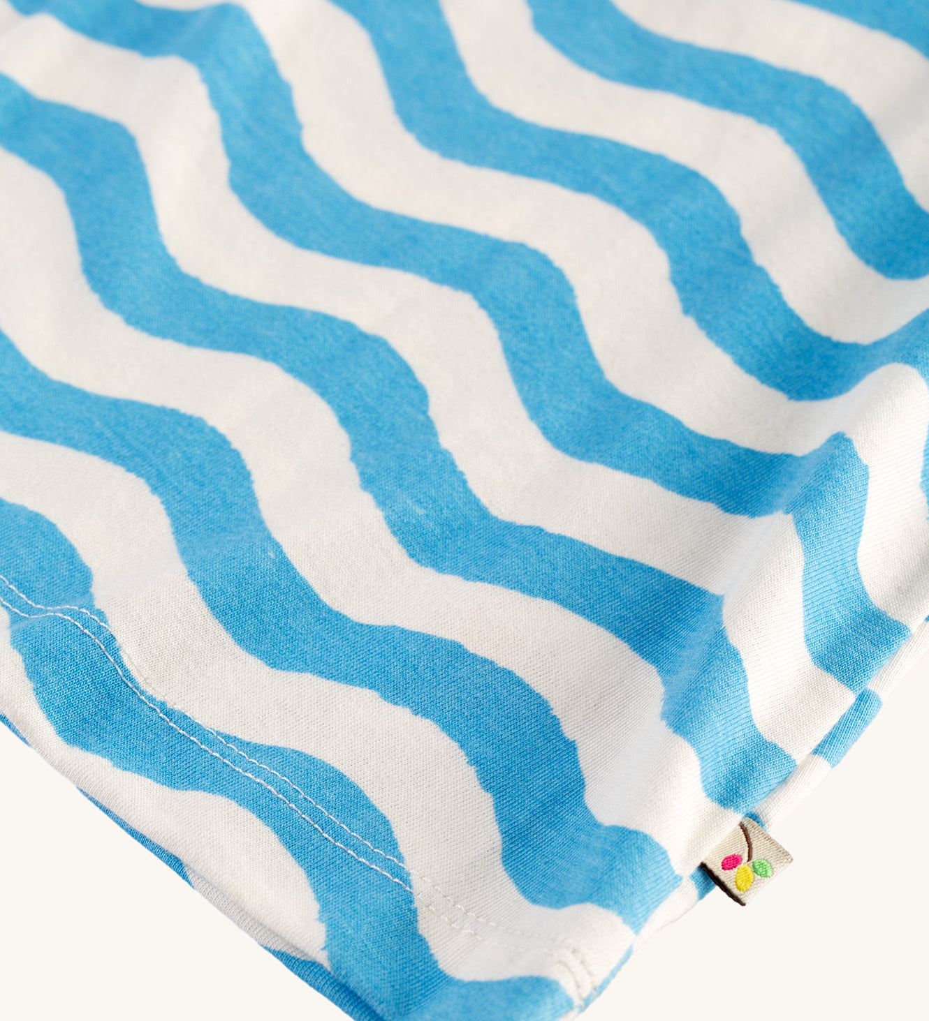 A closer view of the wave pattern on the Frugi Daisies Melody top