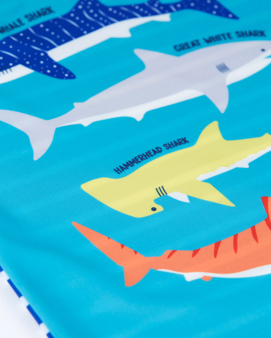  on a cream background. This rash vest passes British Sun-safe standards UPF 40+ and is made wit