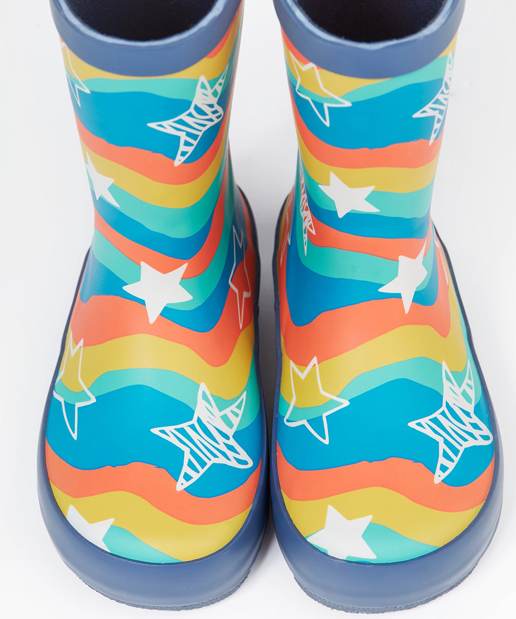 A closer look at the star and rainbow wavy print on the The Frugi Children's Puddle Buster Wellington Boots - Wavy Stars