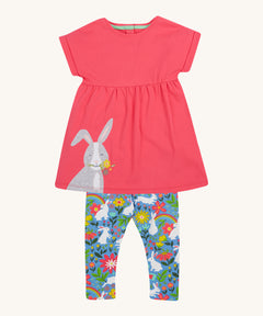 Frugi kids watermelon iris bunny outfit - GOTS organic cotton kids outfit including a light pink top with short sleeves and a grey rabbit appliqué with light blue bottoms with white rabbits and floral prints. 