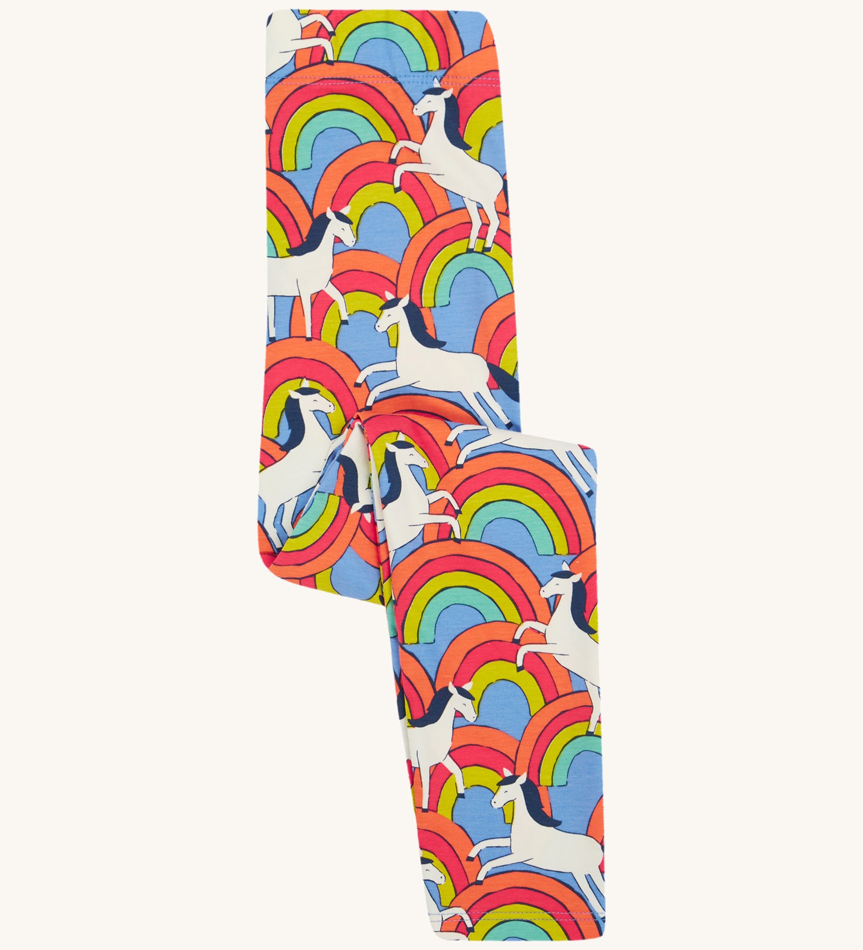 Frugi kids over the rainbow leggings - GOTS organic cotton Frugi kids leggings   in light blue folded in half with white horses on top of bright multicoloured rainbows 