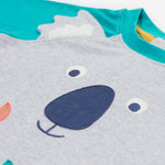 Close up of the Frugi kids koala raglan t-shirt. Showing the grey koala facial features and grey ears stitched loosely on the front panel on grey and blue organic cotton fabric