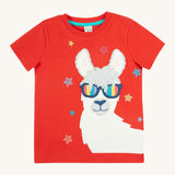 Frugi kids red llama character t-shirt - GOTS organic cotton Frugi t-shirt in red with a red neck trim and light blue inside neck trim. Features a white and grey llama appliqué wearing rainbow sunglasses and surrounded by different coloured embroidered stars. 