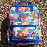  this Explorers Backpack from Frugi comes in a Retro Happy print featuring smiling planets