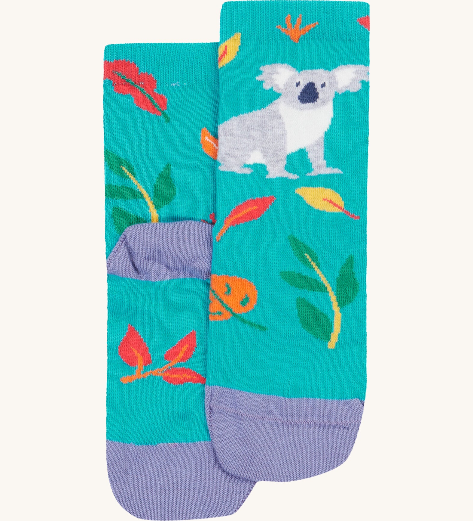 A close up of the Frugi koala rock my socks. A bright blue sock with a grey koala print on the front with coloured leaves. Features a light purple heel and toe contrast panel on organic cotton fabric