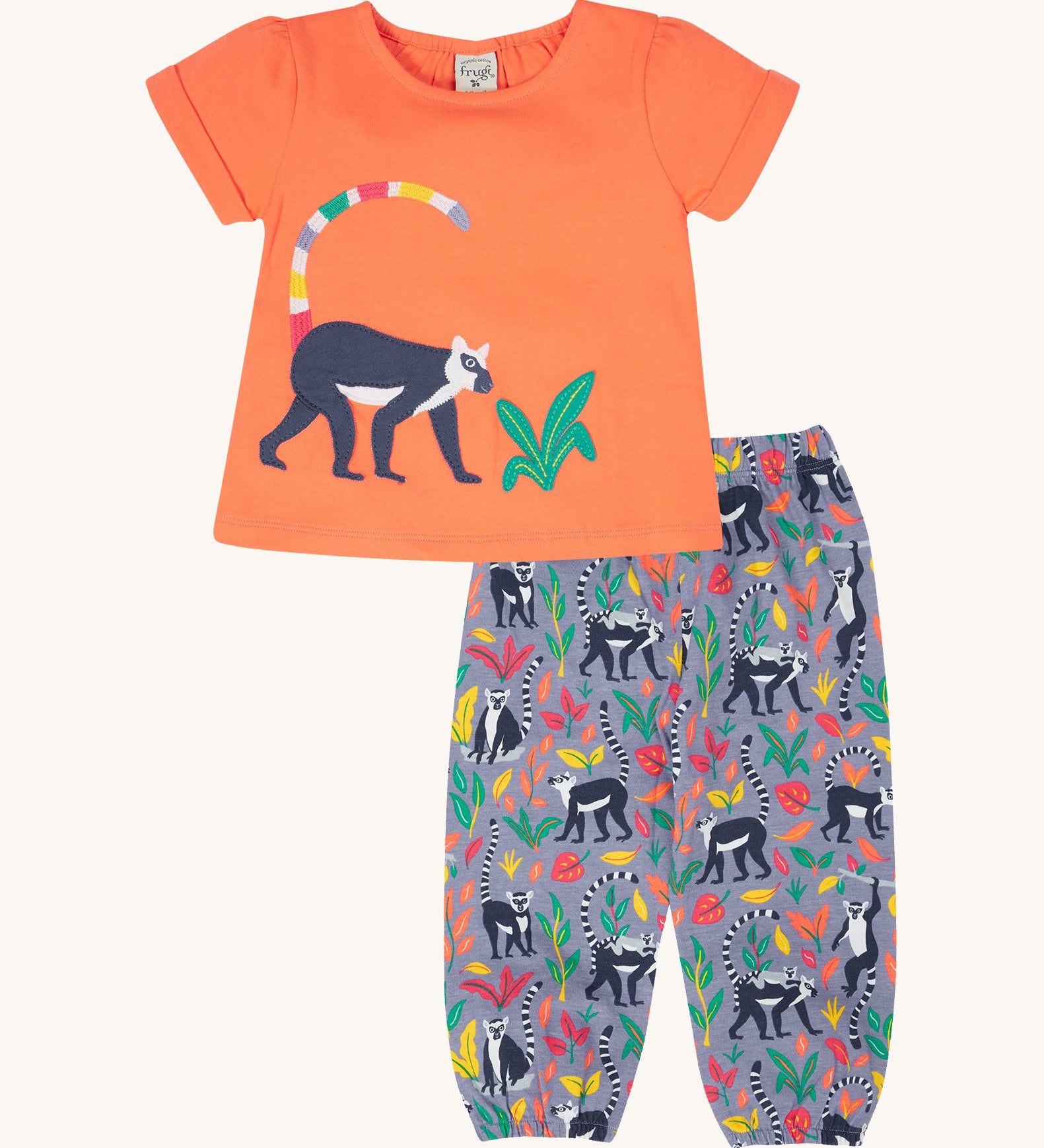 Frugi Rowenna outfit, lemur laugh - GOTS organic cotton kids two piece outfit with a coral short sleeve top and light purple bottoms. Feature an appliqué of a lemur on the top and printed lemurs with coloured leaves on the bottoms