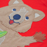 Close up of the Frugi kids strawberry quokka tshirt. Showing the brown quokka appliqué on red organic cotton fabric