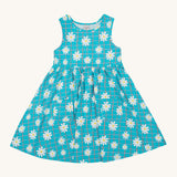 Frugi kids summer holiday dress - GOTS organic cotton kids sleeveless dress in blue check and daisy design. Features two small pockets on the front.