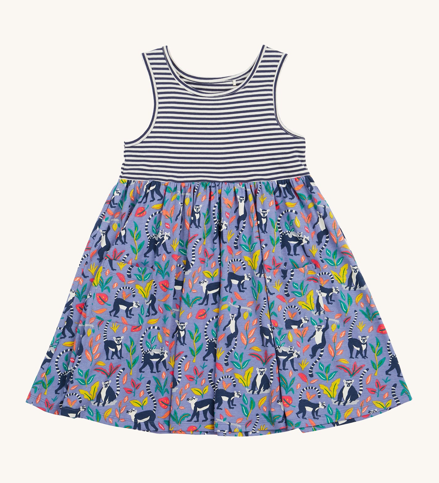 Frugi kids summer holiday dress lemur laughs- GOTS organic cotton kids sleeveless summer dress with a navy and white stripe top half and lemurs on the bottom half surrounded by different coloured leaves  on purple organic cotton fabric