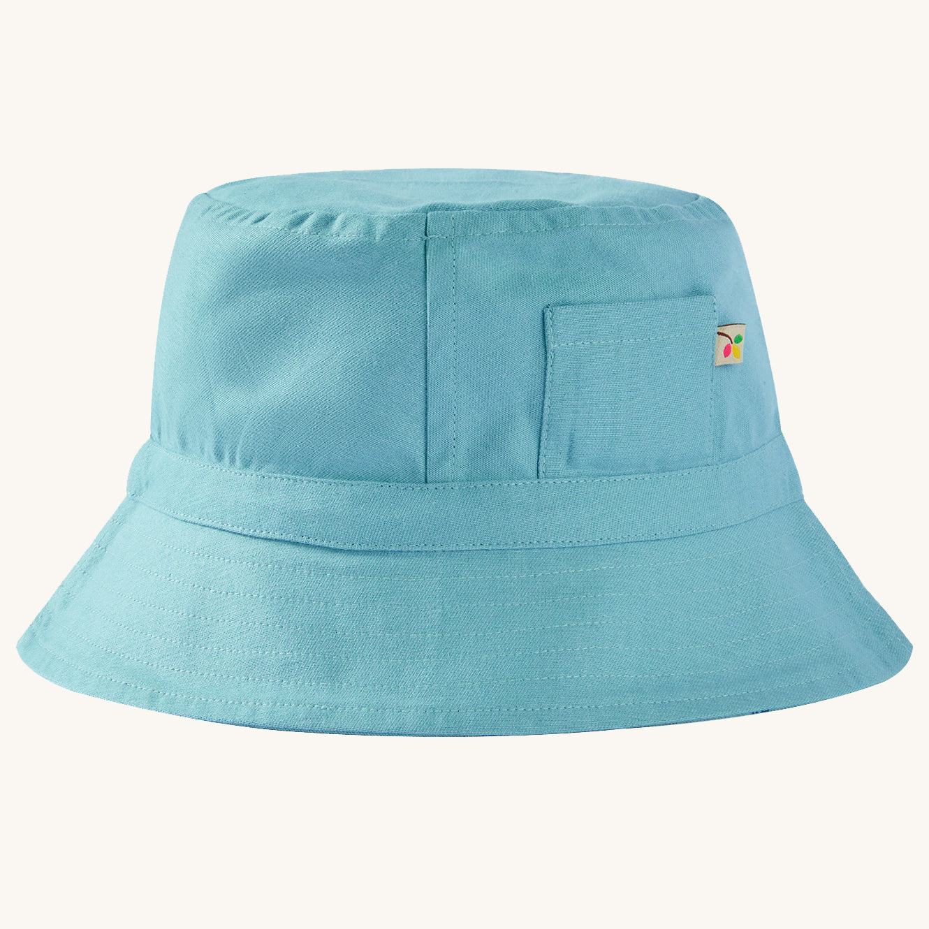  reversible sun hat in light blue. On one side of the hat are beautiful shark prints