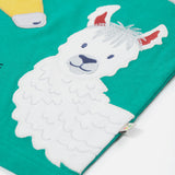 A close up of the Frugi kids long neck pals t-shirt. Showing the white and grey llama appliqué on green organic cotton fabric