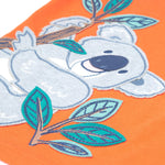 Close up of the Frugi kids orange koala t-shirt. Showing the grey koala applique hanging on embroidered bamboo shoots on light orange organic fabric