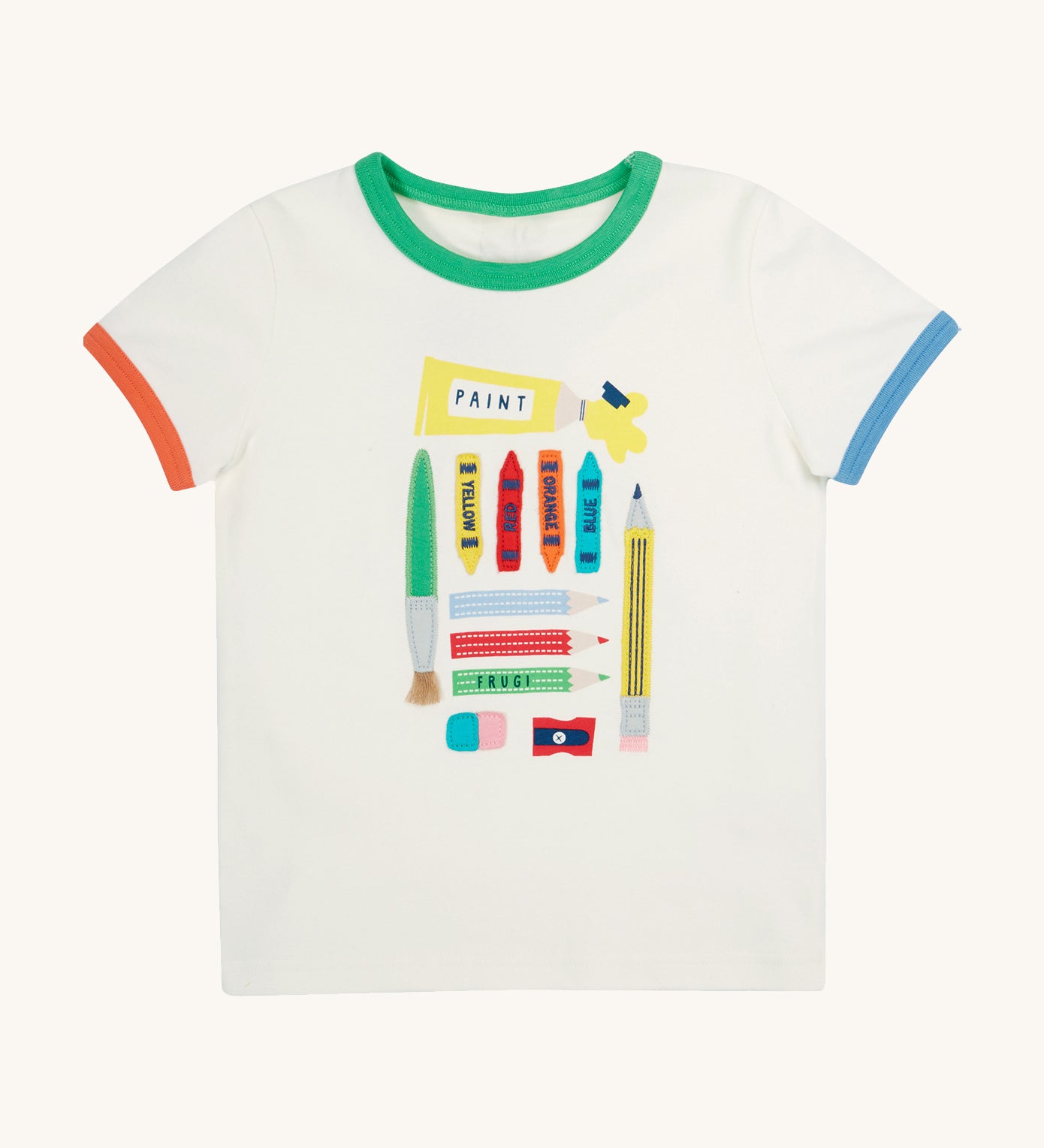 Frugi let's create white Xavier t-shirt - GOTS organic cotton kids t-shirt in white, short sleeves with orange and blue trim on the sleeves and a green trim on the neck line. Features an appliqué and prints of different arts and crafts tools including a brush, pencils, paint, crayons, eraser and a sharpener 