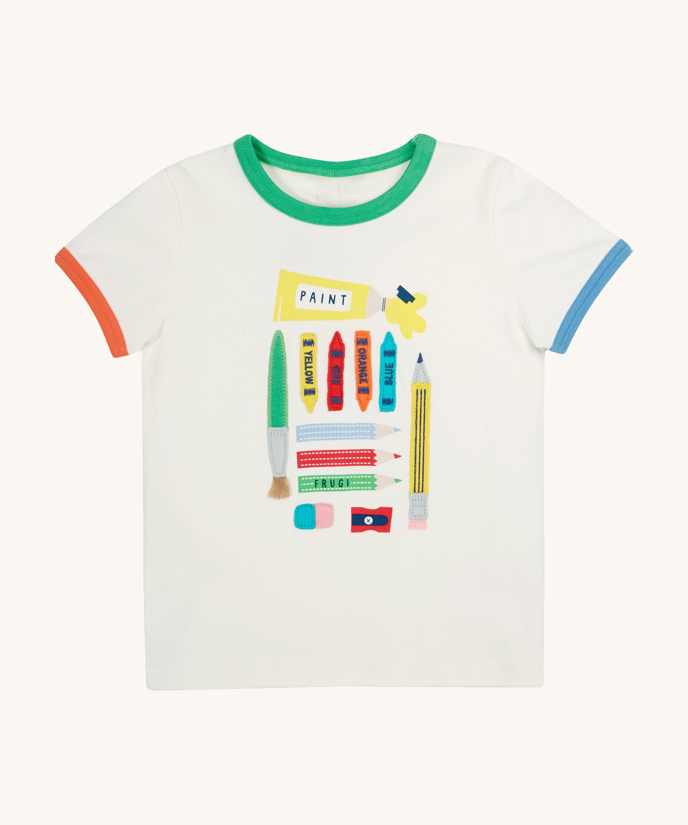 Frugi let's create white Xavier t-shirt - GOTS organic cotton kids t-shirt in white, short sleeves with orange and blue trim on the sleeves and a green trim on the neck line. Features an appliqué and prints of different arts and crafts tools including a brush, pencils, paint, crayons, eraser and a sharpener 