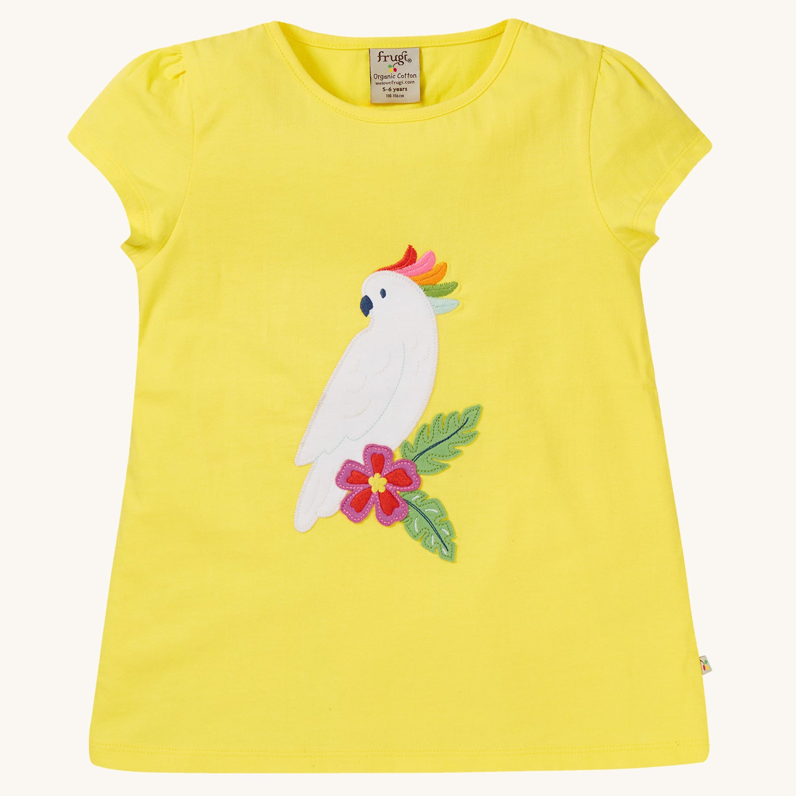 Frugi Children's Organic Cotton Cassia Applique T-Shirt - Cockatoo. A gorgeous sunny yellow, organic cotton Frugi T-Shirt for children features a gorgeous cockatoo applique with a colourful rainbow crest