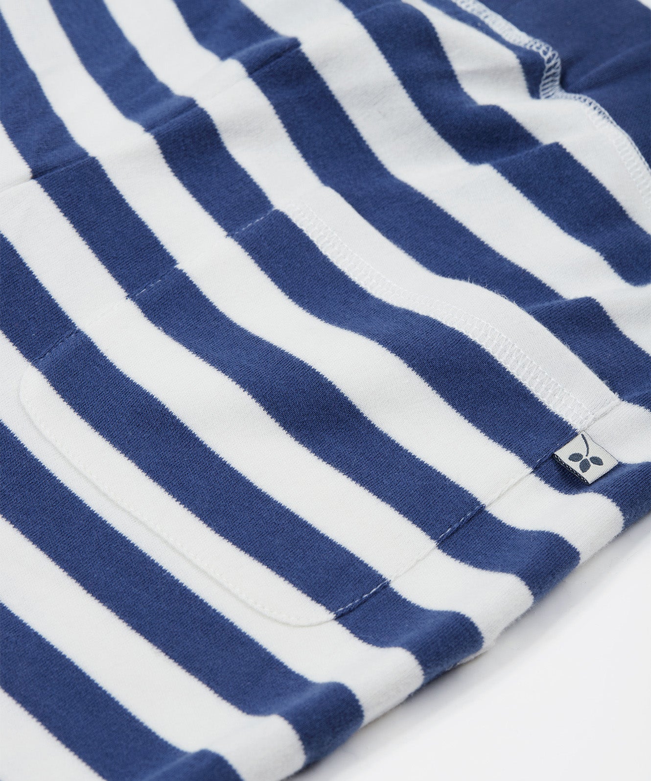 Close up of the Frugi kids sunny koala big stripe short showing the back pocket detail on navy and white organic cotton fabric