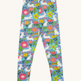 Frugi kids bunny bounce libby leggings - GOTS organic cotton kids light purple leggings. Features a flower and rainbow design with white bunny rabbits. 