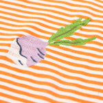 Close up of the Frugi kids lifeboat stripe veg t-shirt. Showing the purple radish appliqué on orange and white stripe organic cotton fabric