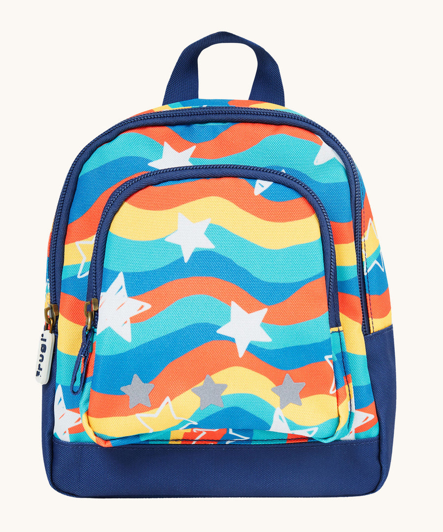 Frugi Little Adventurers Backpack - Wavy Stars. Made from post-consumer recycled plastic, this Little Adventurers Backpack from Frugi comes in a rainbow print, and white and grey stars. This bag has a detachable rein, two zipped pockets, reflective print 