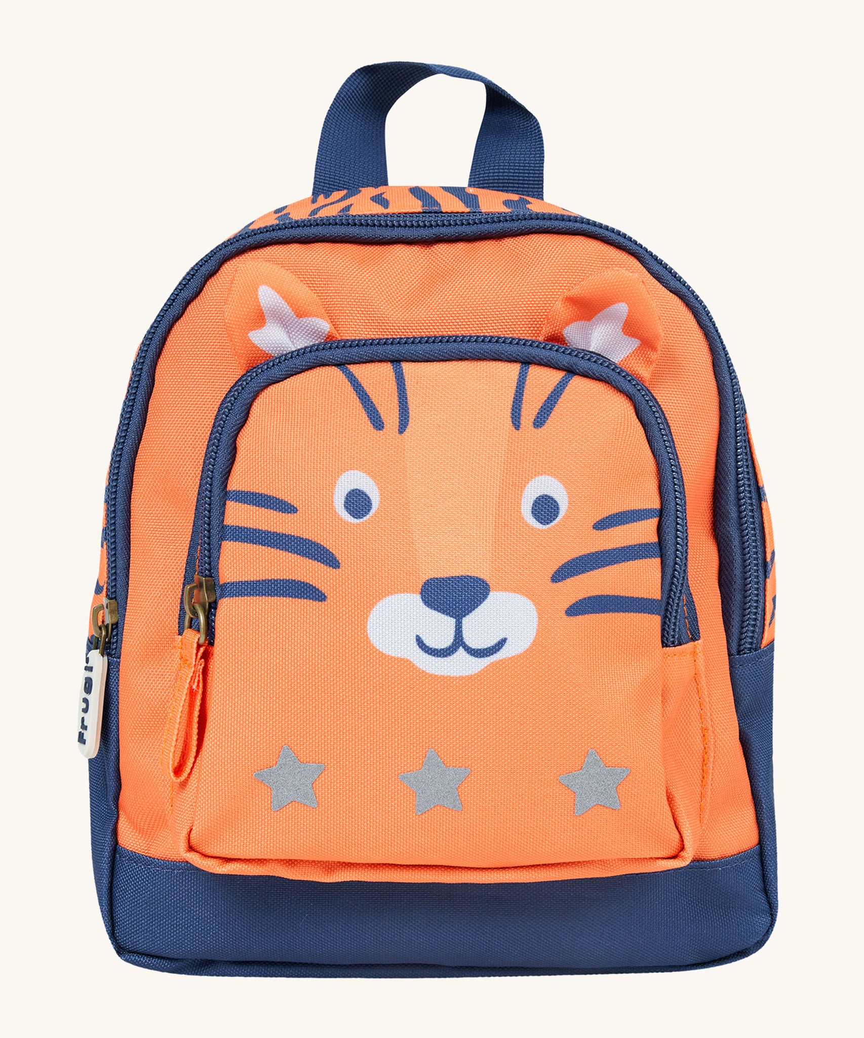 Little Adventurers Backpack - Salamander/Tiger. Made from post-consumer recycled plastic, this Little Adventurers Backpack from Frugi comes in an orange and navy blue Tiger print. This bag has a interactive tiger ears, a detachable rein, two zipped pocket