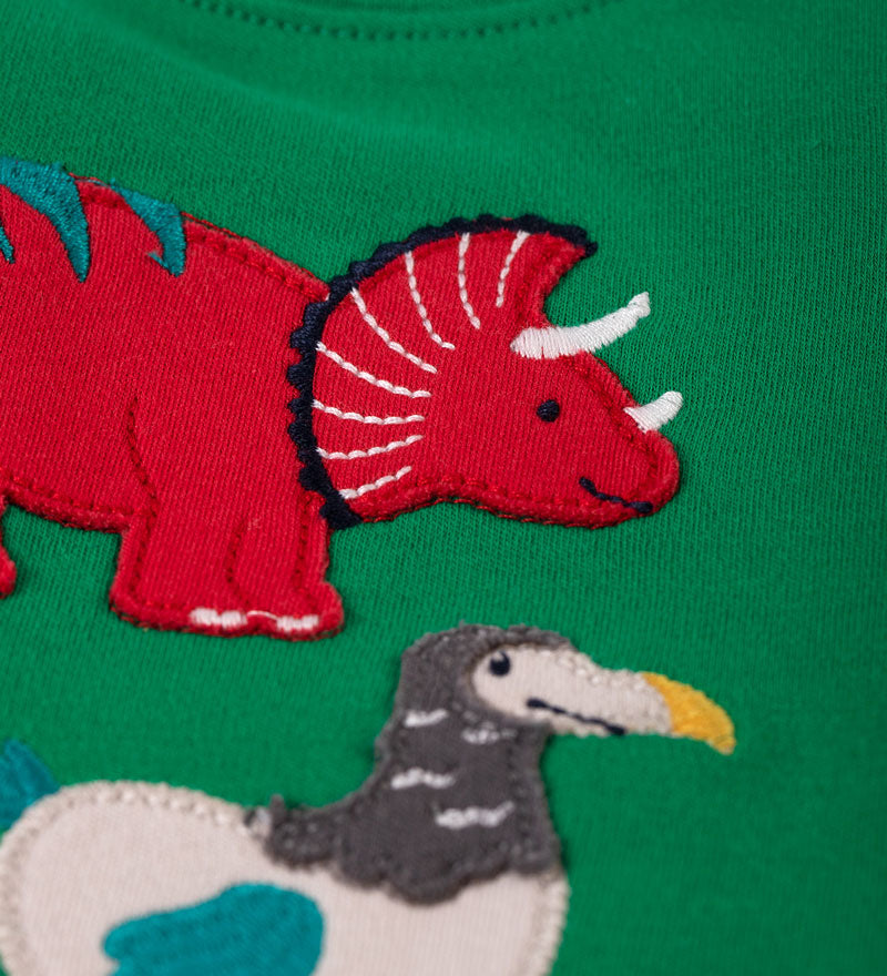 Close up of the red triceratops dino Frugi Little Creature Ribbit Green Dinos Applique Top 