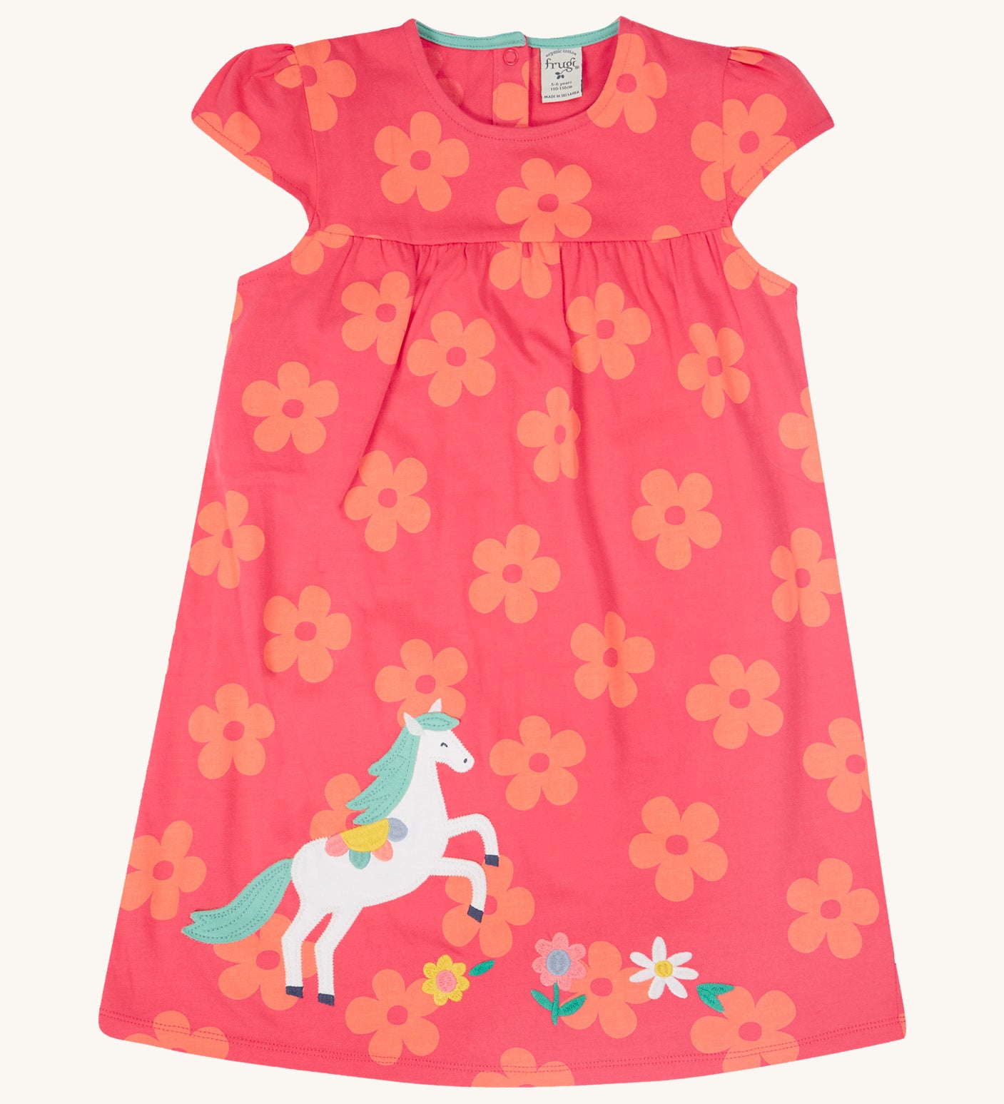 Frugi little Lola floral fun / horse dress - GOTS organic cotton baby dress in light pink with short sleeves and a light blue inside neck trim. Features a white horse appliqué with light green hair next to appliqué flowers surrounded with printed flowers