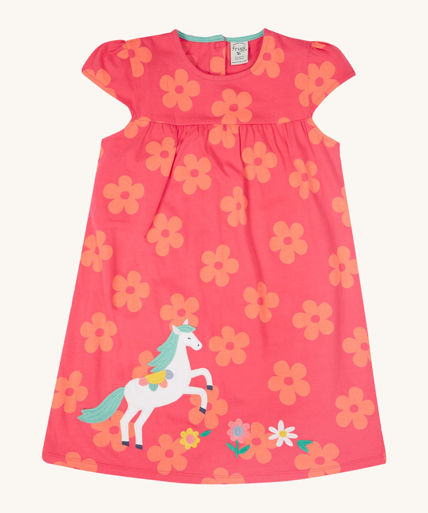 Frugi little Lola floral fun / horse dress - GOTS organic cotton baby dress in light pink with short sleeves and a light blue inside neck trim. Features a white horse appliqué with light green hair next to appliqué flowers surrounded with printed flowers