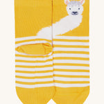 A close up of the Frugi llama sock. Showing the llama design on the yellow cuff on yellow and white stripe organic cotton fabric