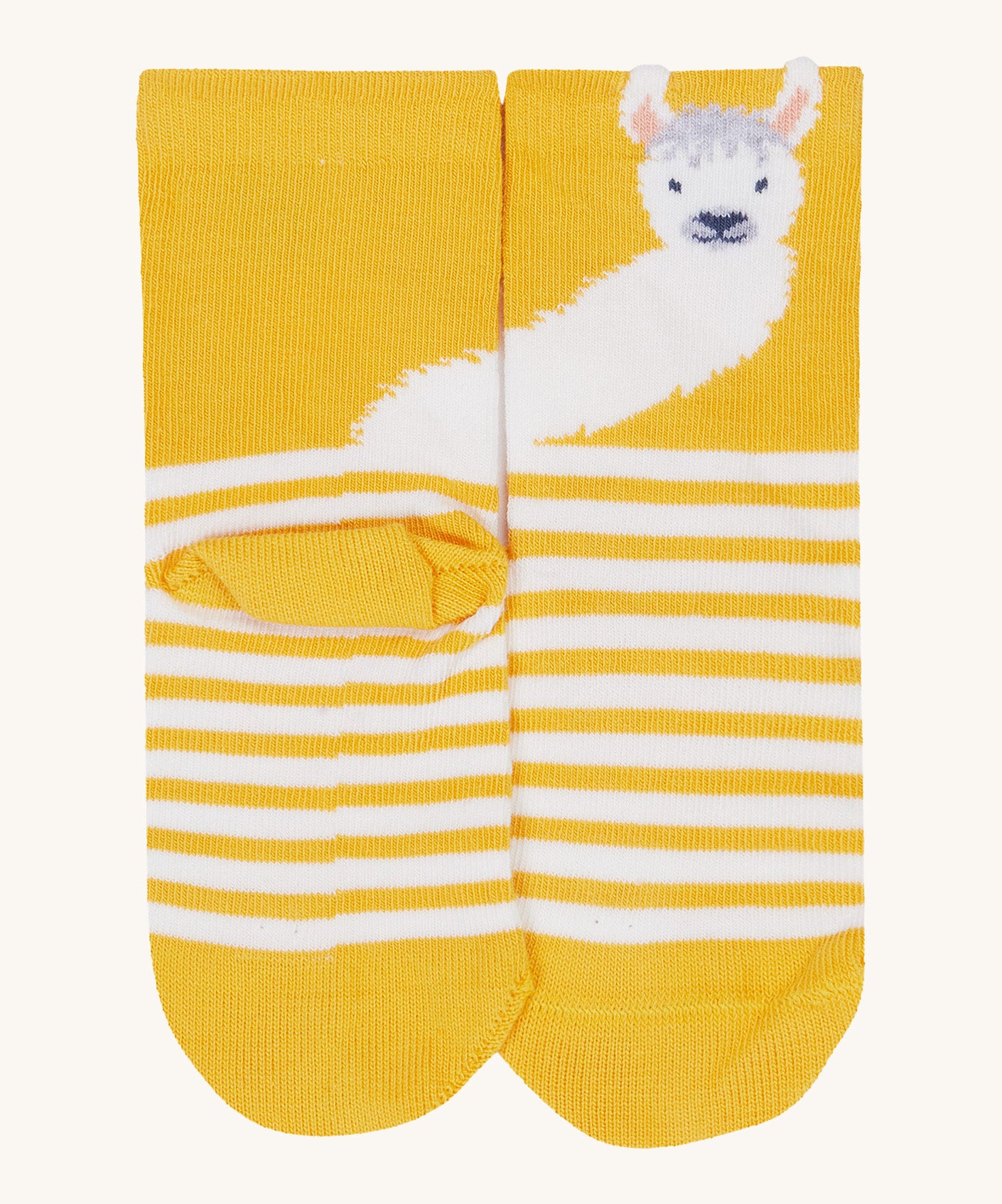 A close up of the Frugi llama sock. Showing the llama design on the yellow cuff on yellow and white stripe organic cotton fabric