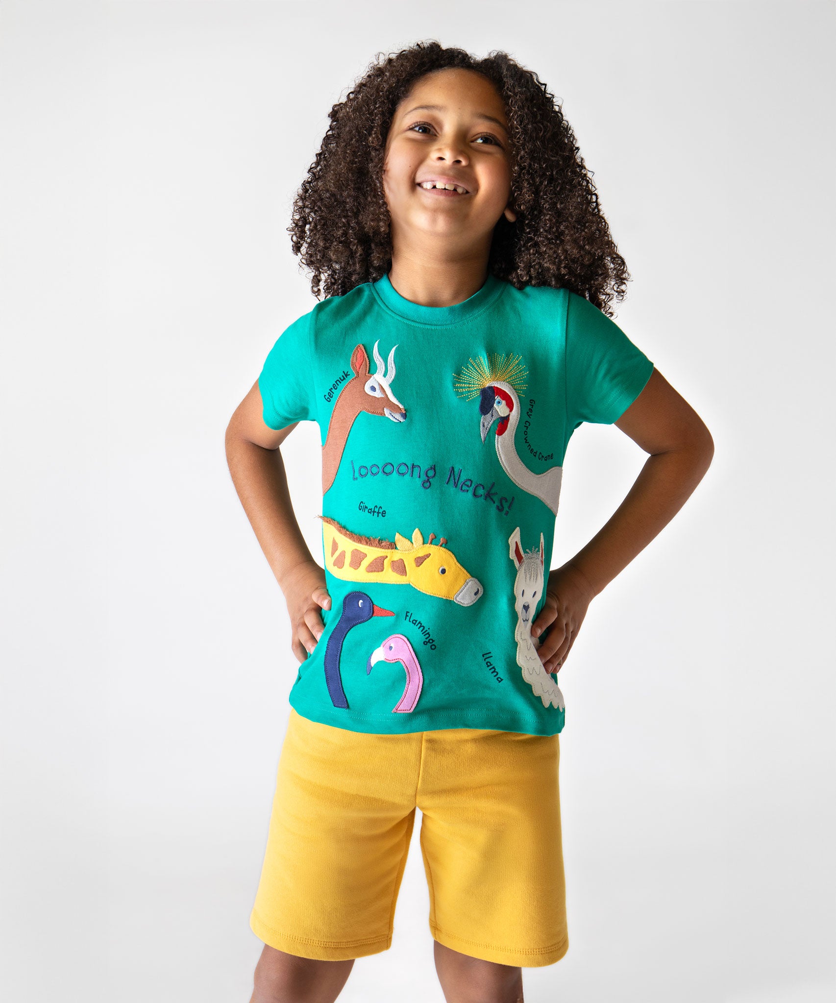 A child wearing a Frugi  Long Neck Pals Carsen Applique organic cotton T-Shirt