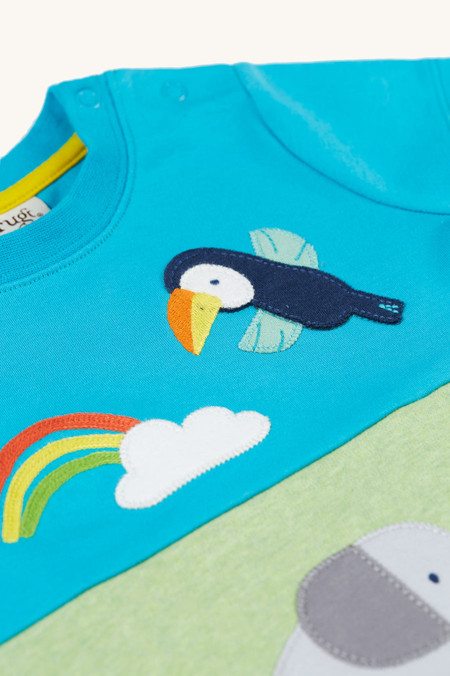  elephant and toucan character applique on the front